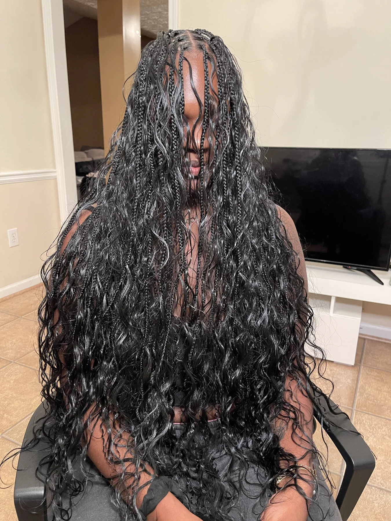 Long black boho braids with loose waves